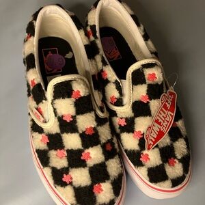 Fuzzy slip on checkered vans with pink stars